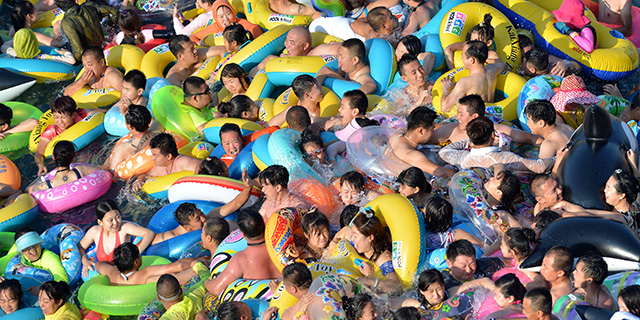 People shown at a water park in China in 2017. China has the world’s largest population, but is projected to slide down to second place in the global population ranking in 2023. 