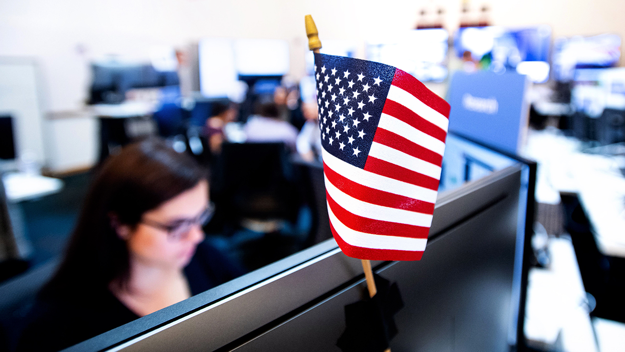 Americans have little confidence in technology companies like Facebook, Twitter and Google to prevent the misuse of their platforms to influence the 2020 presidential election. Above, workers in Facebook's "war room" in Menlo Park, California, in 2018. (Noah Berger/AFP via Getty Images)