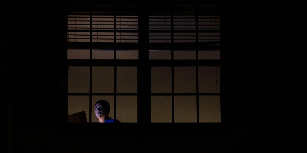 A Florida woman sits at home under quarantine on March 23 after testing positive for the new coronavirus. (Zak Bennett/AFP via Getty Images)