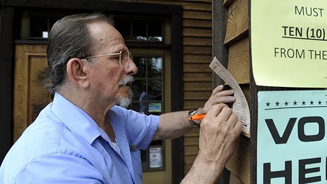 Voter Joe Cieslo fills out an exit poll for the AP, CNN, Fox, NBC, CBS and ABC after voting at the Community Arts Center in Johnstown, Pennsylvania, on April 26, 2016. (Todd Berkey/The Tribune-Democrat via AP)