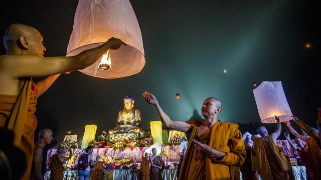 Buddhist monks in Indonesia release a lantern into the air during a 2014 Vesak Day celebration. The holy day celebrates the birth of Gautama Buddha, the founder of Buddhism. (Ulet Ifansasti/Getty Images)