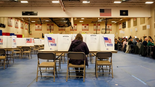 A voter casts a ballot in Bedford, New Hampshire, for the state’s primary on Feb. 11. (Matthew Cavanaugh/Getty Images)
