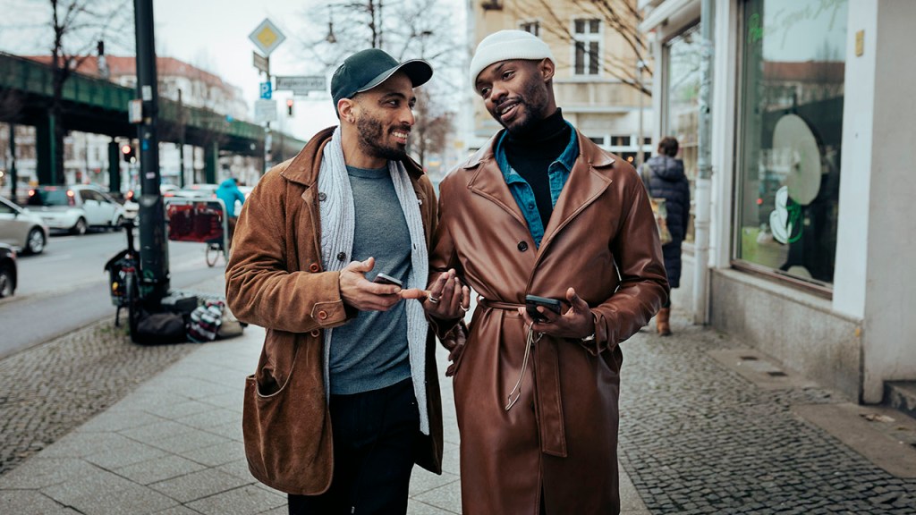 Gay Couple Walking Down Street After Meeting On Dating App