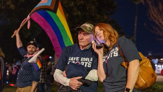 People supporting transgender athletes' participation in and restriction from sports gather outside a Riverside Unified School District meeting outside Los Angeles on Dec. 19, 2024. (Allen J. Schaben/Los Angeles Times via Getty Images)
