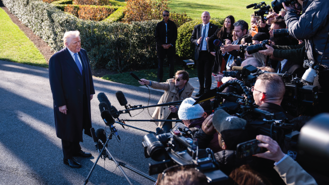 President Donald Trump speaks with reporters on the White House South Lawn on March 21, 2025.