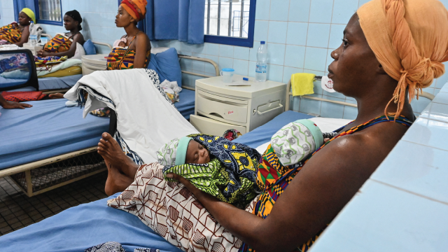 Mothers hold their babies at Treichville University Hospital Center in Abidjan, Ivory Coast, on June 19, 2023. (Issouf Sanogo/AFP via Getty Images)