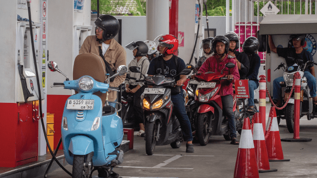 Motorcyclists line up to refuel at a gas station in Yogyakarta, Indonesia, on March 28, 2026. (Devi Rahman/AFP via Getty Images)